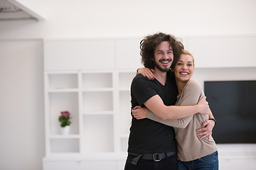 Image showing couple hugging in their new home