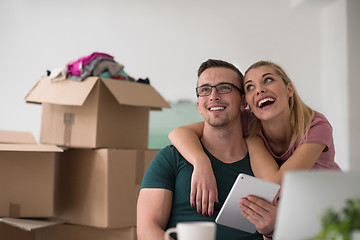 Image showing Young couple moving in a new home