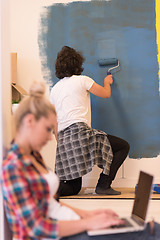 Image showing Happy couple doing home renovations