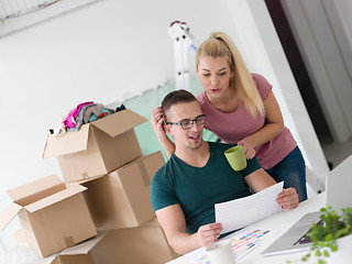 Image showing Young couple moving in a new home