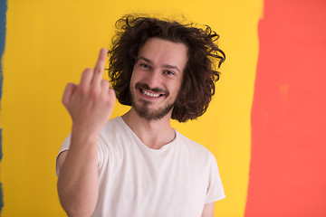 Image showing young man with funny hair over color background