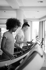 Image showing people exercisinng a cardio on treadmill in gym