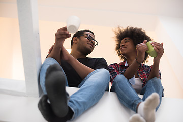 Image showing couple having break during moving to new house