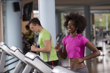 Image showing people exercisinng a cardio on treadmill