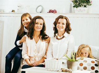 Image showing Mature sisters twins at home with little daughter, happy family 