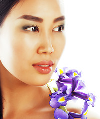 Image showing young pretty asian woman with flower orchid close up isolated sp