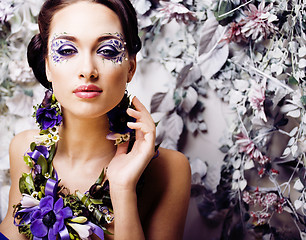 Image showing floral face art with anemone in jewelry, sensual young brunette 