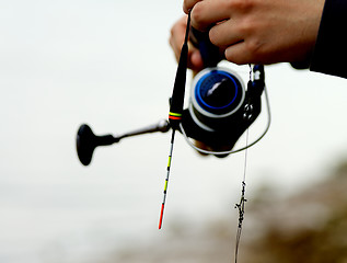 Image showing Man Holding Fishing Rod