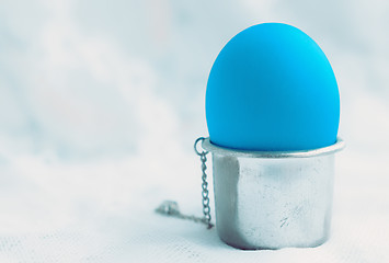 Image showing Blue Egg In A Silver Stand