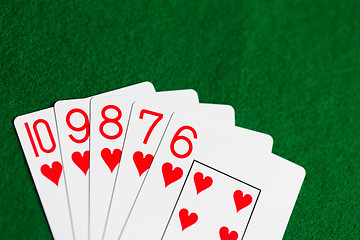 Image showing poker hand of playing cards on green casino cloth