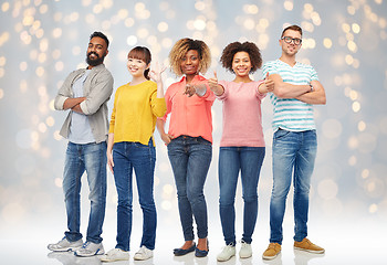 Image showing international group of happy people over lights