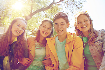 Image showing happy teenage students or friends outdoors