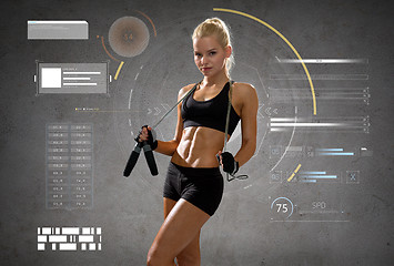 Image showing young sporty woman with jumping rope