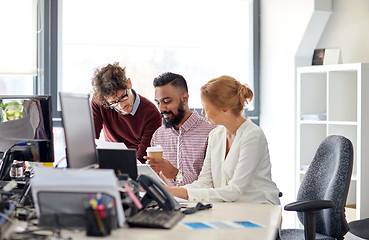 Image showing business team with tablet pc in office