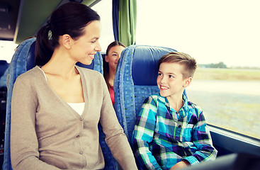 Image showing happy family riding in travel bus