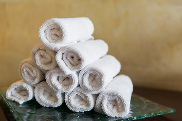 Image showing rolled bath towels at hotel spa