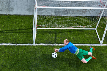 Image showing Soccer football goalkeeper making diving save