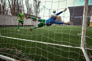 Image showing Soccer football goalkeeper making diving save