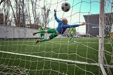 Image showing Soccer football goalkeeper making diving save