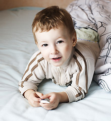 Image showing little cute boy in bed , lifestyle people concept