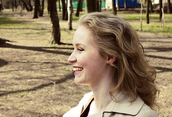 Image showing young pretty blonde girl enjoing spring nature in park, lifestyl