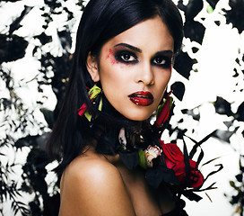 Image showing pretty brunette woman with rose jewelry, black and red, bright m