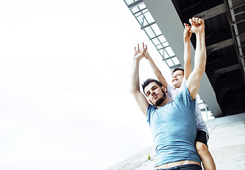 Image showing mature father with his son under the bridge having fun together happy family, lifestyle people concept 