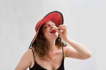 Image showing Woman, strawberry and hat