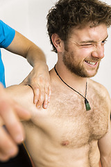 Image showing young man at the physio therapy with pain