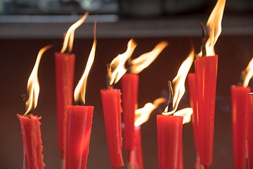 Image showing Candles at taoist shrine burning slowly