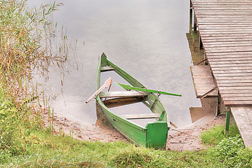 Image showing Abandoned boat on a lake shore