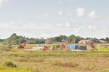 Image showing Many working old oil pumps