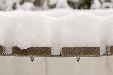 Image showing snow on the bench