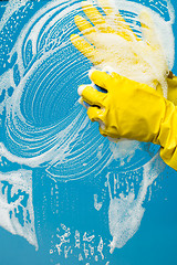 Image showing Man in gloves washes glass