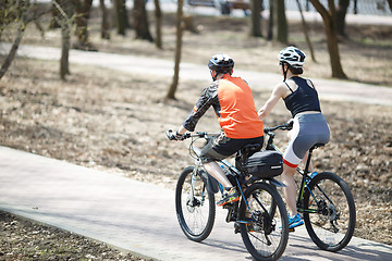 Image showing Photo of cyclists from behind