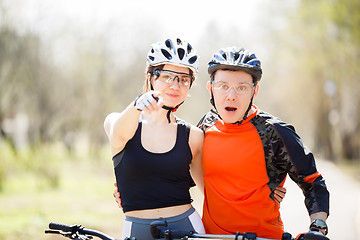 Image showing Young cyclists in protective helmets