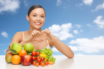 Image showing woman with fruits and vegetables showing heart