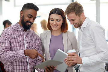 Image showing business team with tablet pc and coffee at office