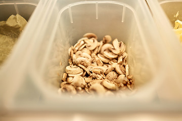 Image showing container with champignons at restaurant kitchen