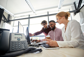 Image showing business team with laptop and coffee in office