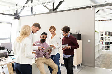 Image showing business team with tablet pc and coffee at office