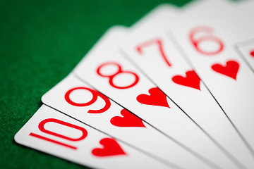 Image showing poker hand of playing cards on green casino cloth