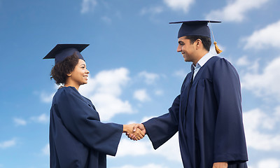 Image showing happy students or bachelors greeting each other