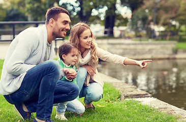 Image showing happy family walking in summer park