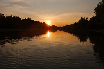 Image showing Sunset over a river