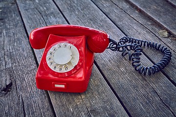 Image showing Old telephone on wooden boards