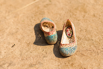 Image showing Children\'s shoes in dirt