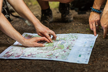 Image showing Navigating with map and compass