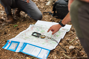 Image showing Navigating with map and compass