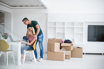 Image showing Young couple moving in a new home